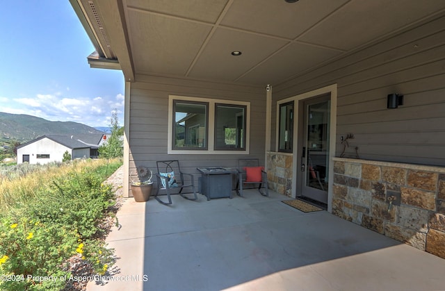 view of patio / terrace featuring a mountain view