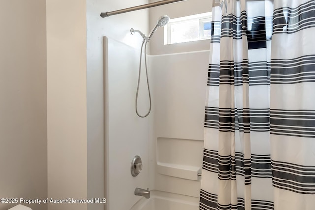 2618 Apache Ct, Rifle, CO 81650 - bathroom with shower / tub combo with curtain