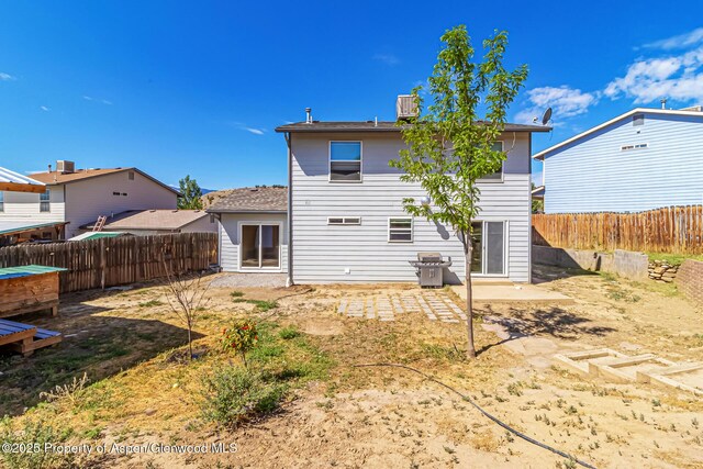 2618 Apache Ct, Rifle, CO 81650 - rear view of property with a fenced backyard and a patio
