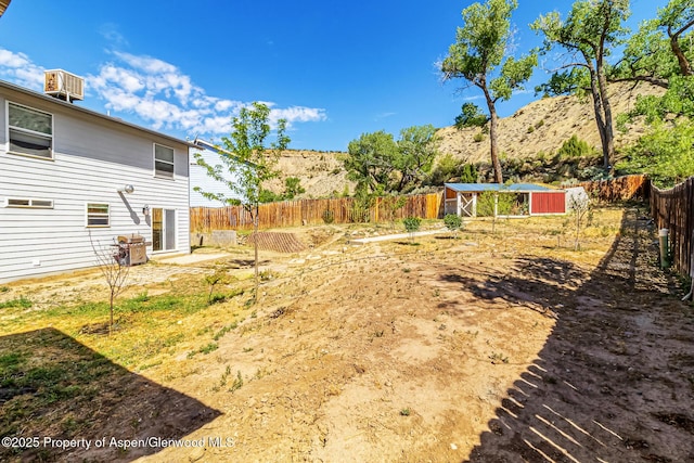2618 Apache Ct, Rifle, CO 81650 - fenced backyard with an outdoor structure