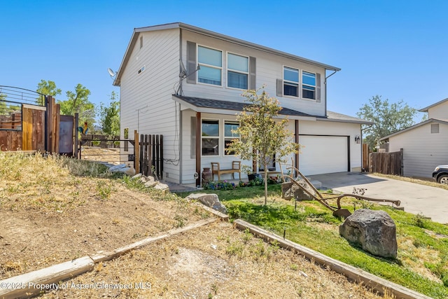 2618 Apache Ct, Rifle, CO 81650 - traditional home with driveway, an attached garage, and roof with shingles
