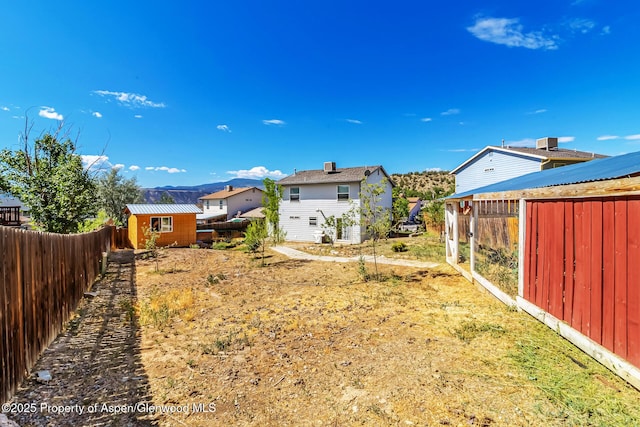 2618 Apache Ct, Rifle, CO 81650 - fenced backyard featuring a storage unit
