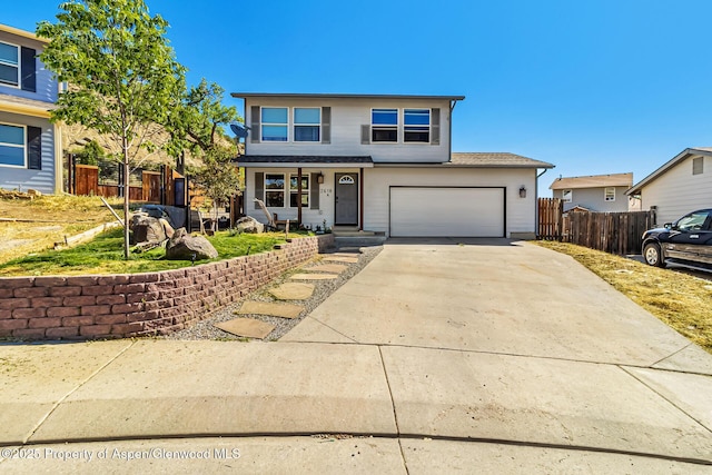 2618 Apache Ct, Rifle, CO 81650 - traditional-style home with driveway, a garage, and a shingled roof