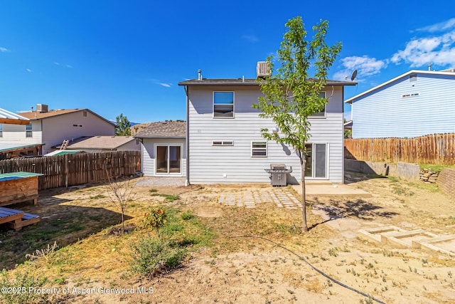 2618 Apache Ct, Rifle, CO 81650 - rear view of property with a fenced backyard and a patio