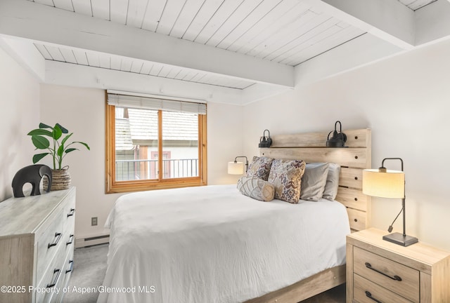 carpeted bedroom featuring a baseboard heating unit, beam ceiling, and wood ceiling