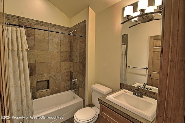 full bathroom featuring toilet, vanity, vaulted ceiling, and shower / bath combo with shower curtain