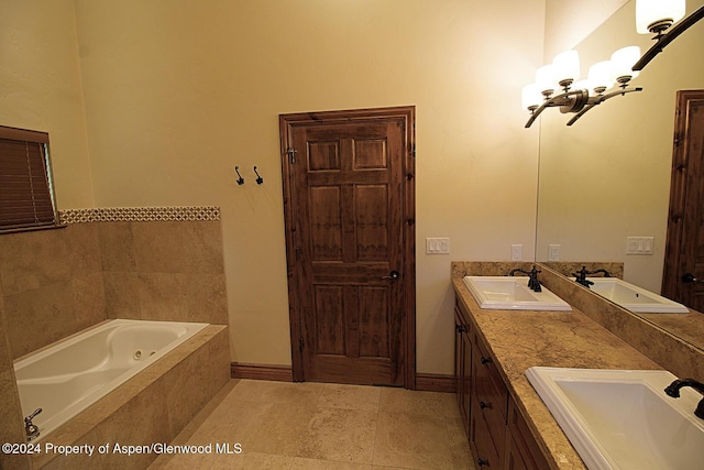 bathroom with tiled bath and vanity