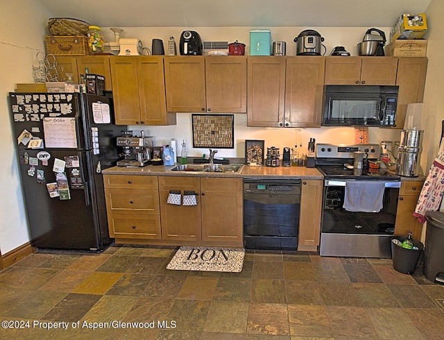 kitchen with sink and black appliances