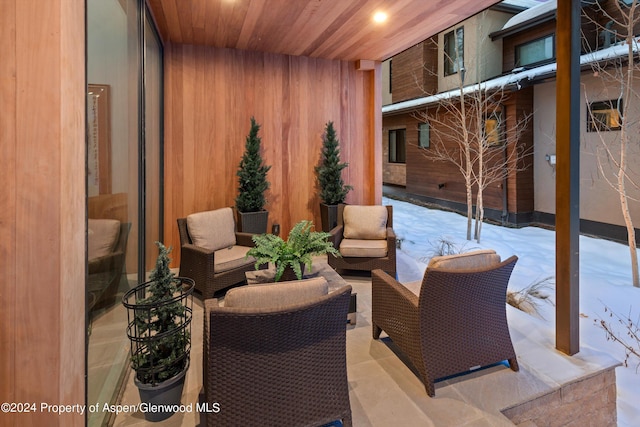 snow covered patio featuring an outdoor hangout area