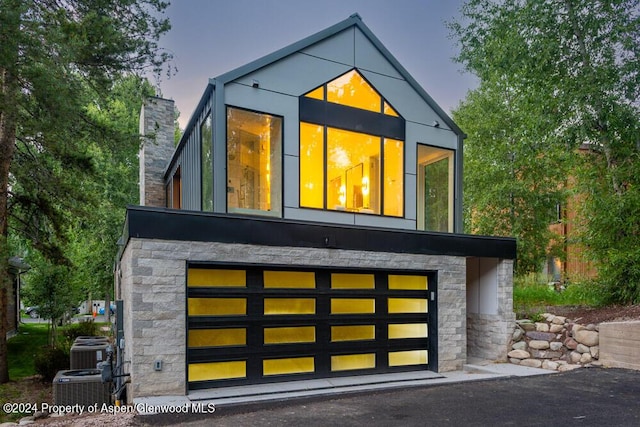 property exterior at dusk with central AC