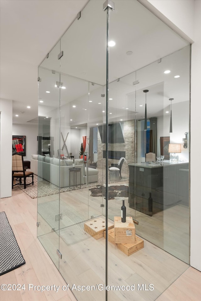 bathroom with separate shower and tub and hardwood / wood-style flooring