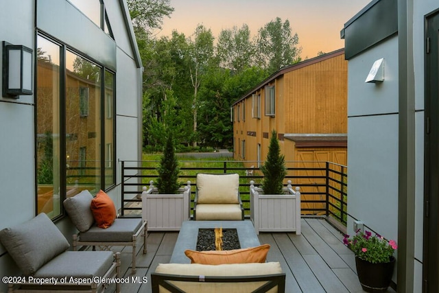 balcony at dusk with a fire pit