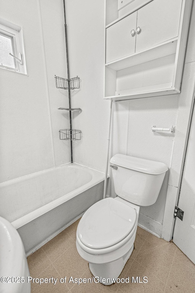 774 School St, Craig, CO 81625 - bathroom with shower / bathtub combination and tile patterned floors