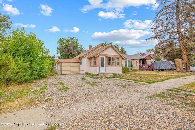 774 School St, Craig, CO 81625 - bungalow-style home with stucco siding and a chimney