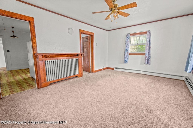 774 School St, Craig, CO 81625 - unfurnished room with carpet floors, a ceiling fan, a baseboard heating unit, and crown molding