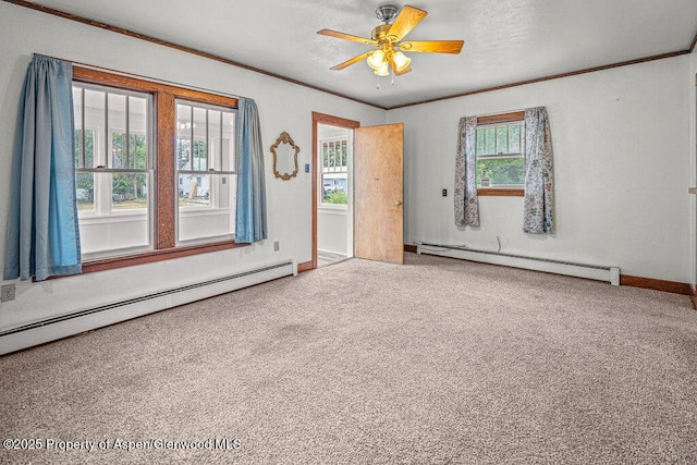 774 School St, Craig, CO 81625 - empty room with a baseboard heating unit, carpet, ceiling fan, and crown molding