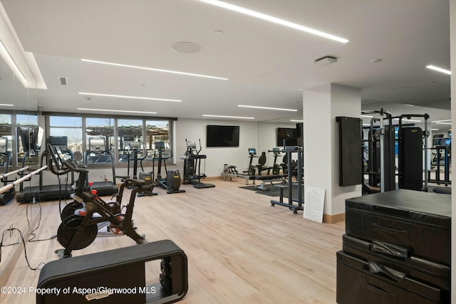 workout area with light wood-type flooring