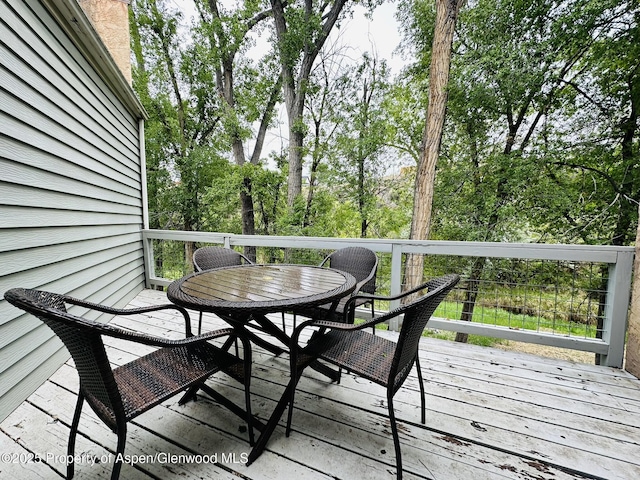 1024 E Ave, Rifle, CO 81650 - wooden deck featuring outdoor dining space