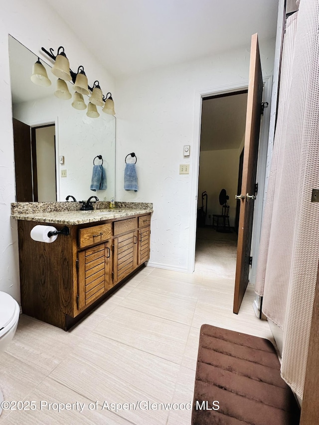 1024 E Ave, Rifle, CO 81650 - bathroom featuring vanity and toilet