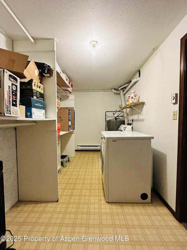 1024 E Ave, Rifle, CO 81650 - laundry area featuring light flooring, baseboard heating, independent washer and dryer, and a textured ceiling