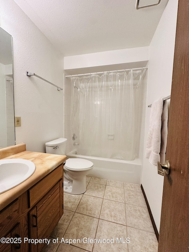1024 E Ave, Rifle, CO 81650 - bathroom featuring vanity, shower / tub combo, toilet, tile patterned floors, and a textured ceiling