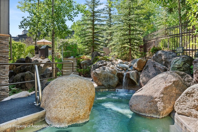 600 Carriage Way Unit L-12, Snowmass Village, CO 81615 - exterior view of a garden pond