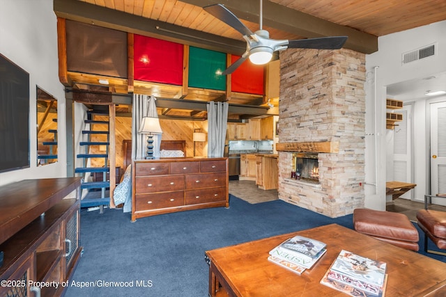 600 Carriage Way Unit L-12, Snowmass Village, CO 81615 - carpeted living room with ceiling fan, a wood ceiling with exposed beams, a fireplace, a high ceiling, and stairway