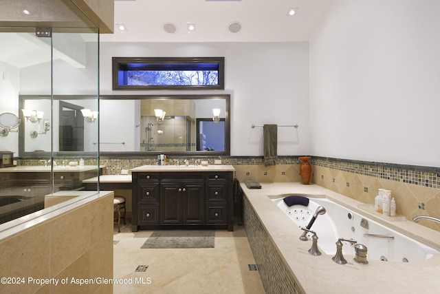 bathroom featuring tile patterned floors, vanity, independent shower and bath, and vaulted ceiling