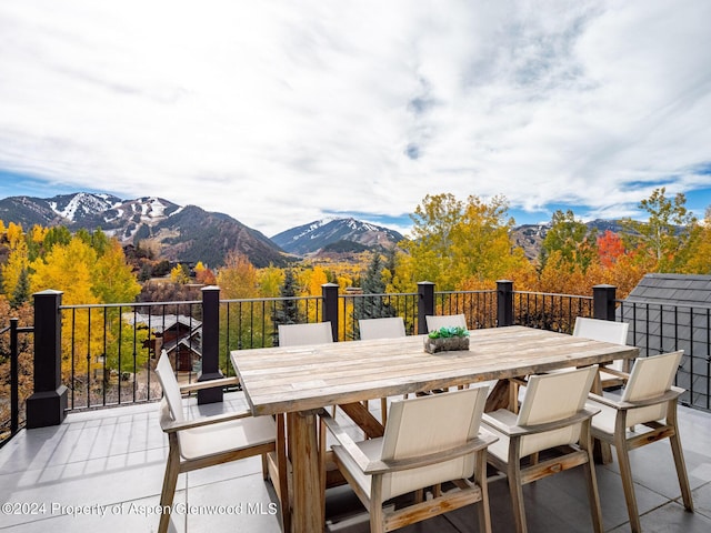 wooden terrace featuring a mountain view