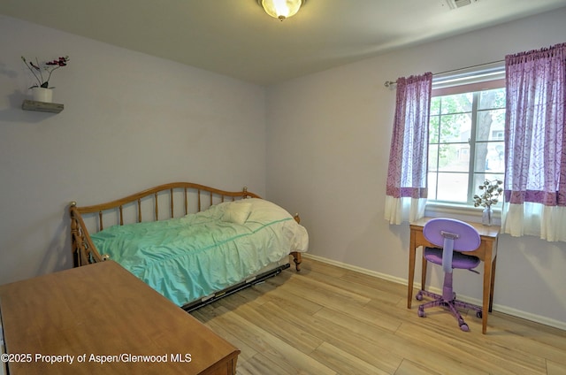 41 Angelica Cir, Parachute, CO 81635 - bedroom with wood finished floors and baseboards