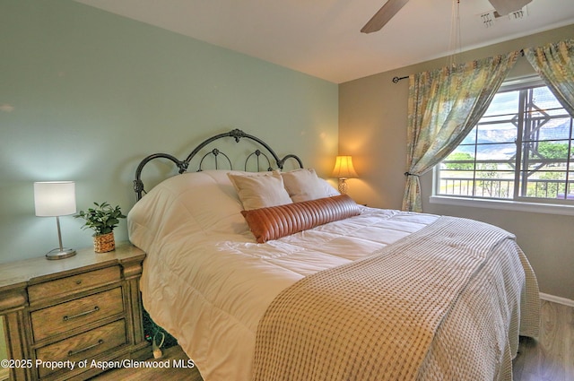 41 Angelica Cir, Parachute, CO 81635 - bedroom featuring wood finished floors, baseboards, and a ceiling fan
