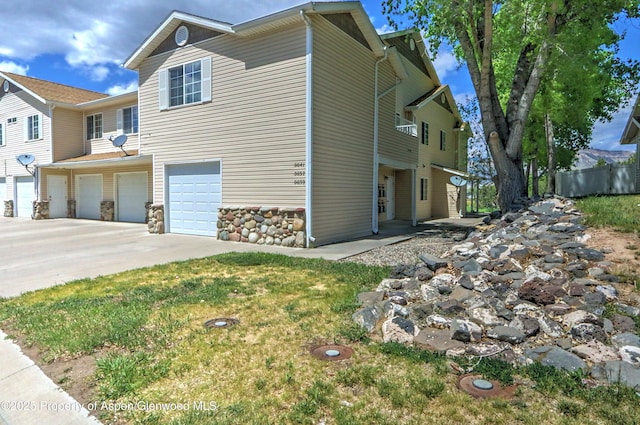 41 Angelica Cir, Parachute, CO 81635 - view of property exterior featuring an attached garage and driveway