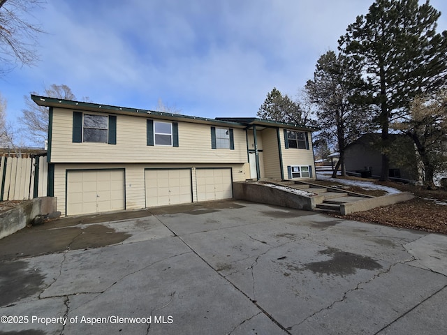 split foyer home featuring a garage