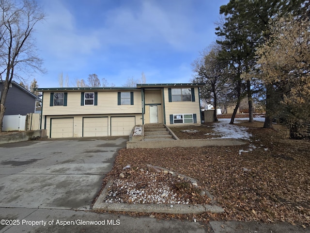 bi-level home featuring a garage