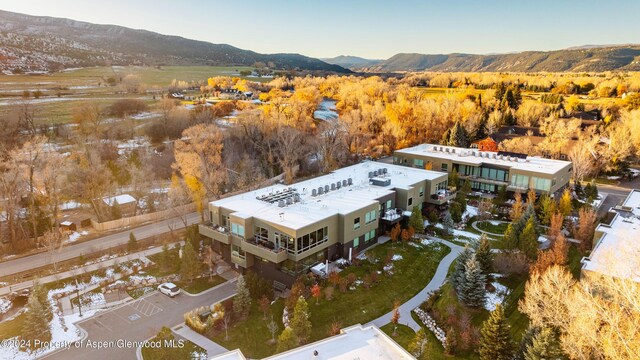 drone / aerial view featuring a mountain view