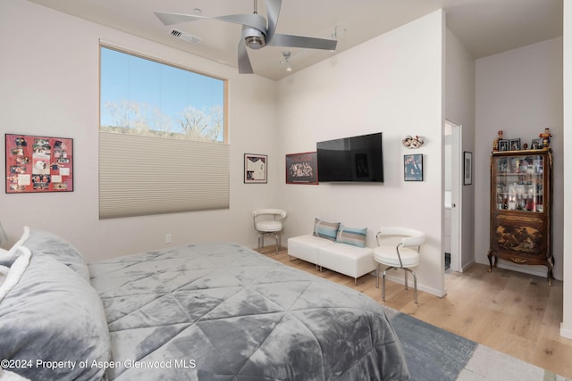 bedroom featuring ceiling fan and hardwood / wood-style floors