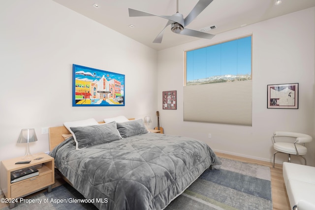 bedroom featuring ceiling fan and hardwood / wood-style floors