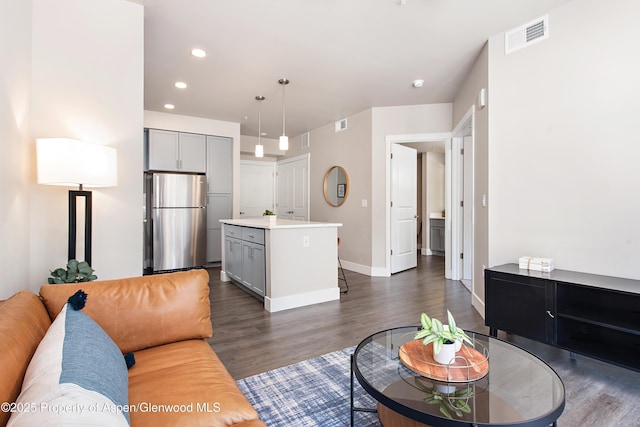 253 Wulfsohn Rd Unit 122, Glenwood Springs, CO 81601 - living room with baseboards, recessed lighting, dark wood finished floors, and visible vents