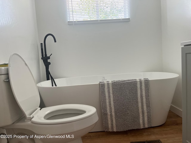 16125 57 8/10 Rd, Collbran, CO 81624 - bathroom featuring a soaking tub and wood finished floors