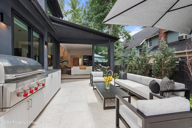 view of patio with an outdoor living space and grilling area