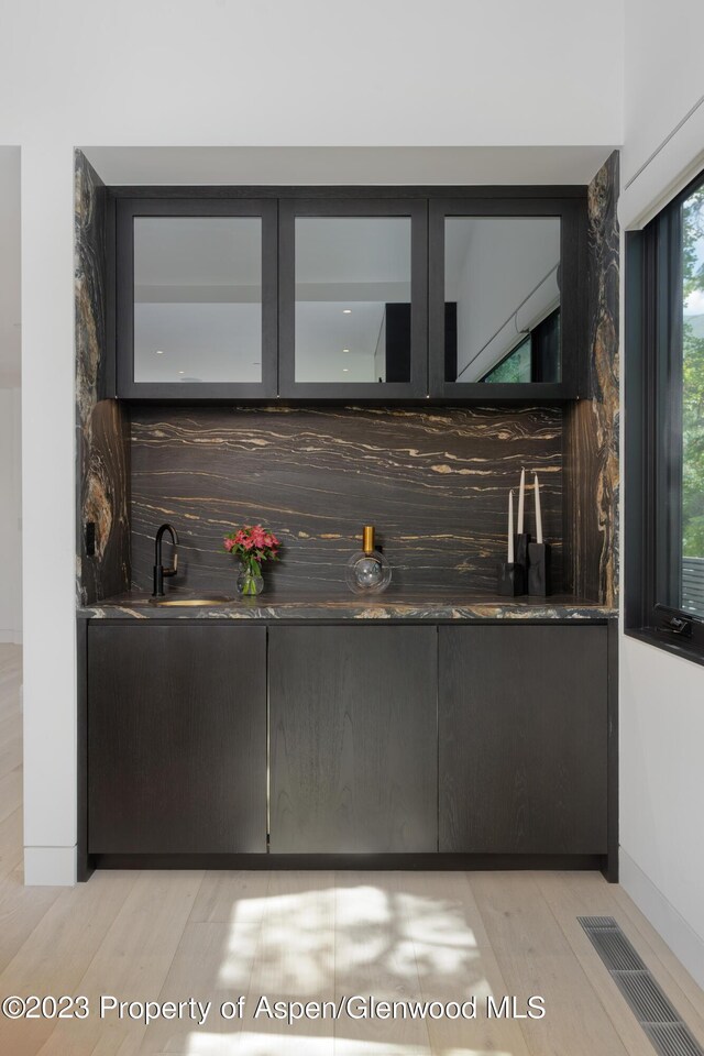 725 W Smuggler St, Aspen, CO 81611 - bar featuring light wood-type flooring and sink