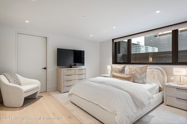 bedroom with light wood-type flooring