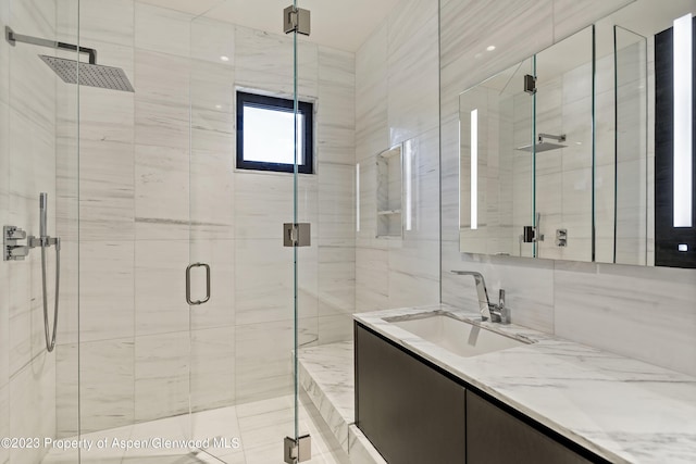 bathroom with vanity and walk in shower