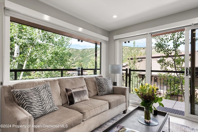 living room with hardwood / wood-style flooring and plenty of natural light