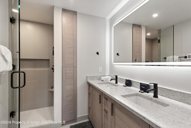 bathroom with vanity and walk in shower