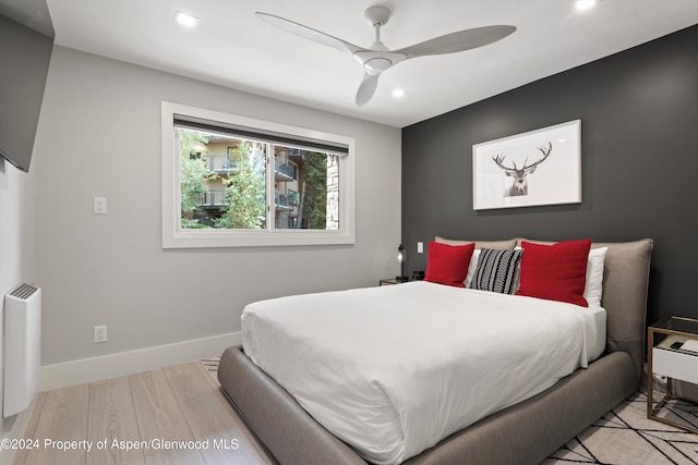 bedroom featuring ceiling fan and light wood-type flooring