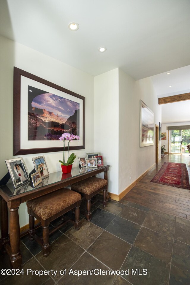 hallway with beamed ceiling