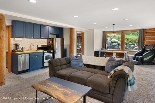 2134 Lower River Rd, Snowmass, CO 81654 - living room with light colored carpet and recessed lighting