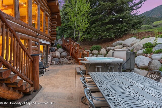 2134 Lower River Rd, Snowmass, CO 81654 - view of patio with stairway, outdoor dining area, and a mountain view