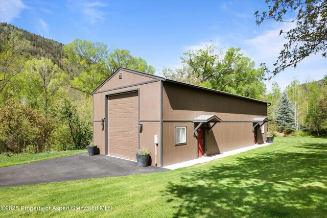 2134 Lower River Rd, Snowmass, CO 81654 - view of outbuilding with an outbuilding and a wooded view
